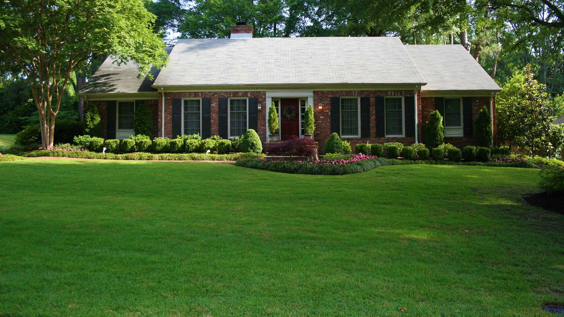 Germantown, TN home with regular landscape maintenance.