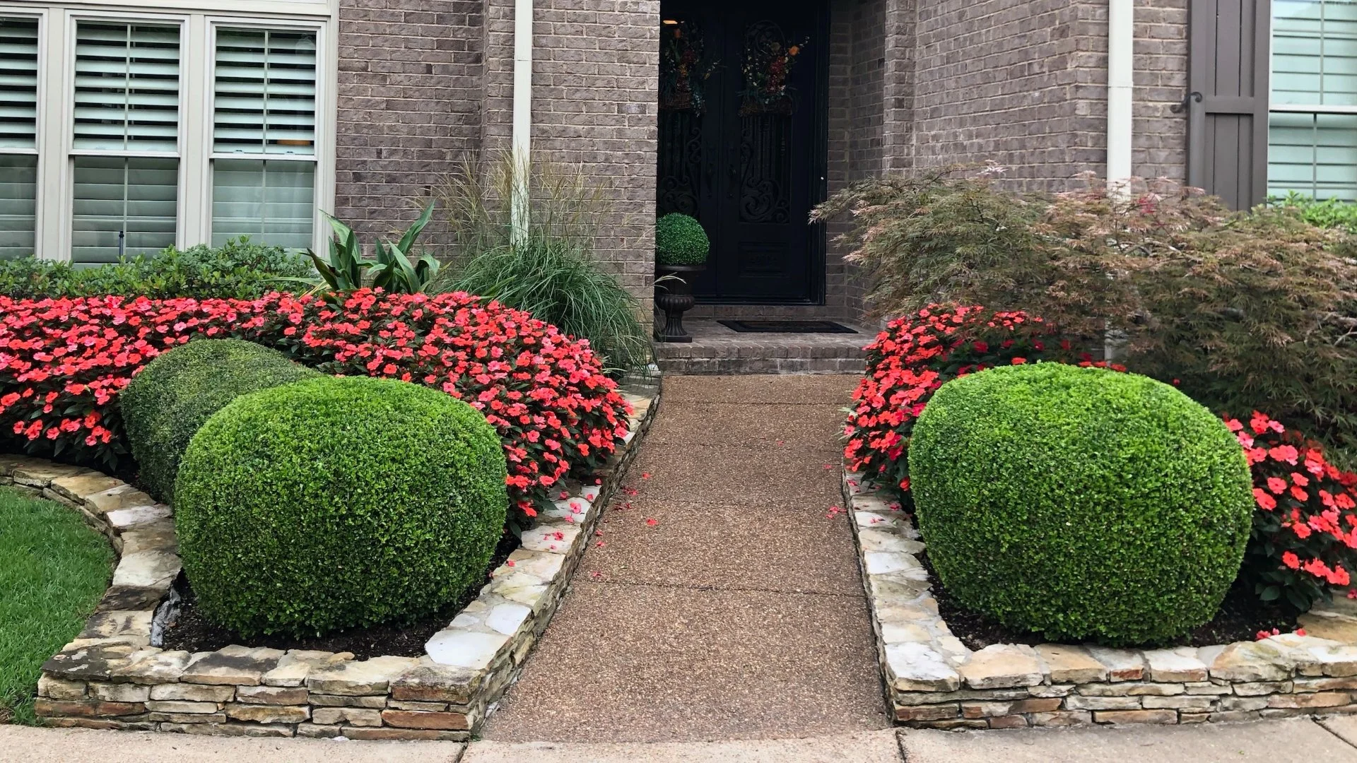 Flowers and shrubs in landscape beds.
