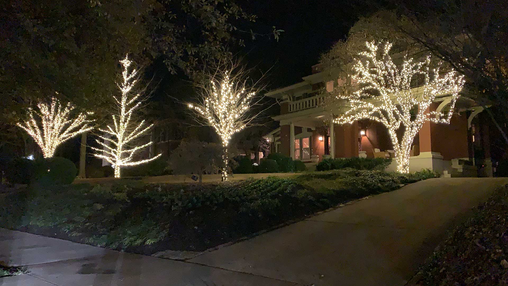Home in Bartlett, TN with holiday lighting decorations.