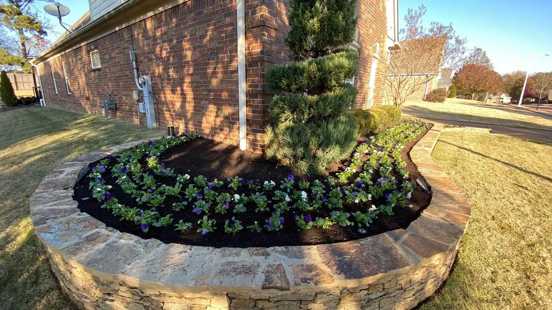 A landscape bed installed beside a home in Cordova, TN.