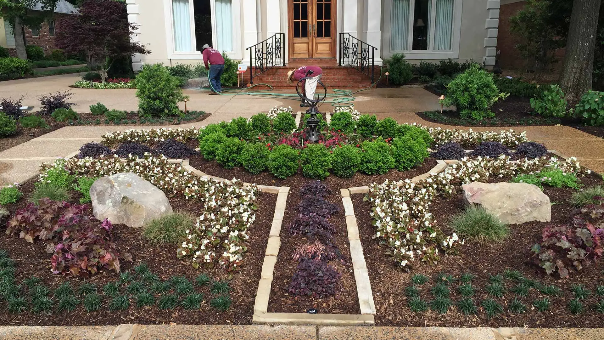 Landscape bed with many different kinds of plants in Bartlett, TN.