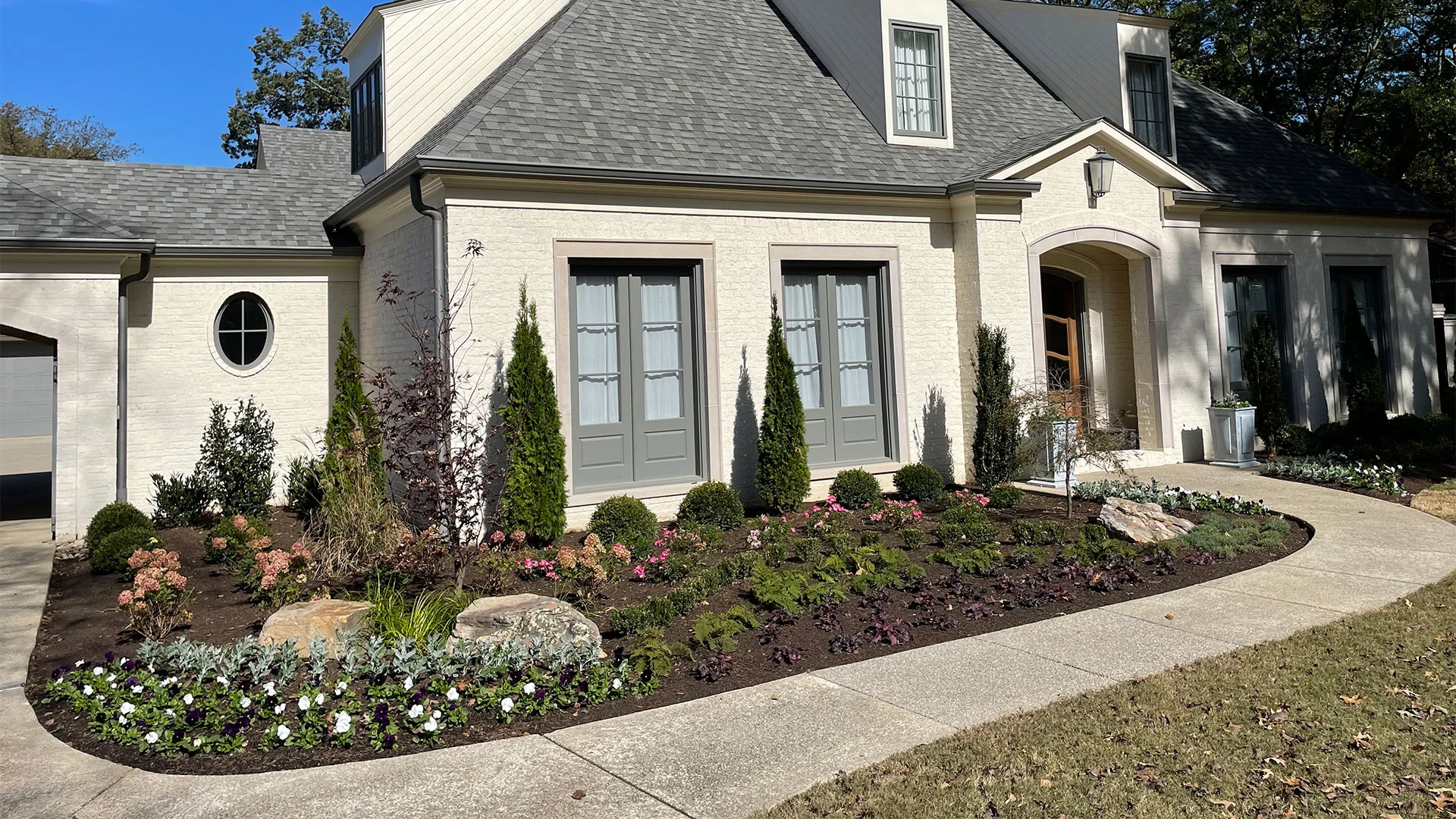 Large mulch installation with plantings near Lakeland, TN.