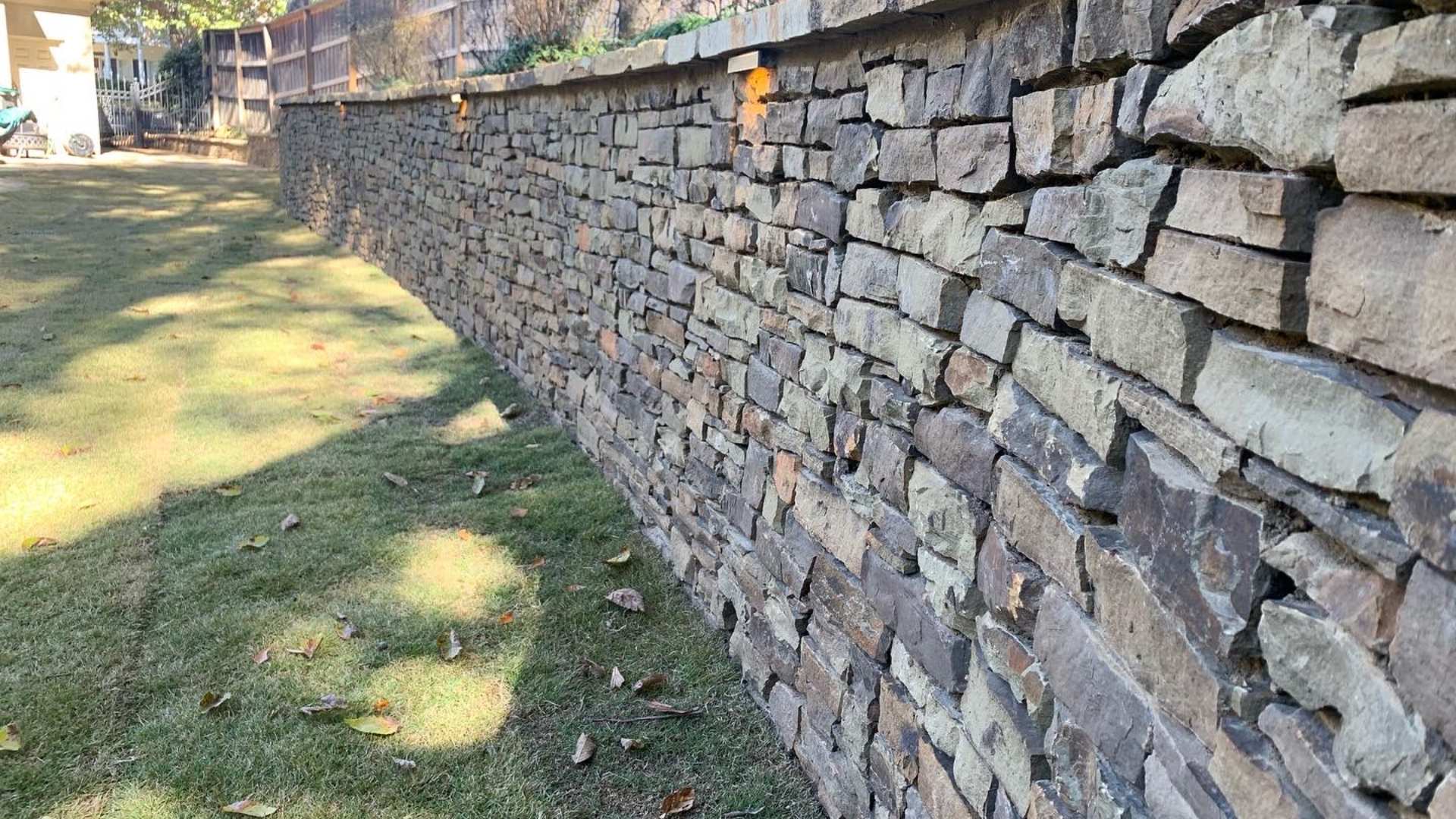 Retaining stone wall built in backyard in Downtown Memphis, TN.