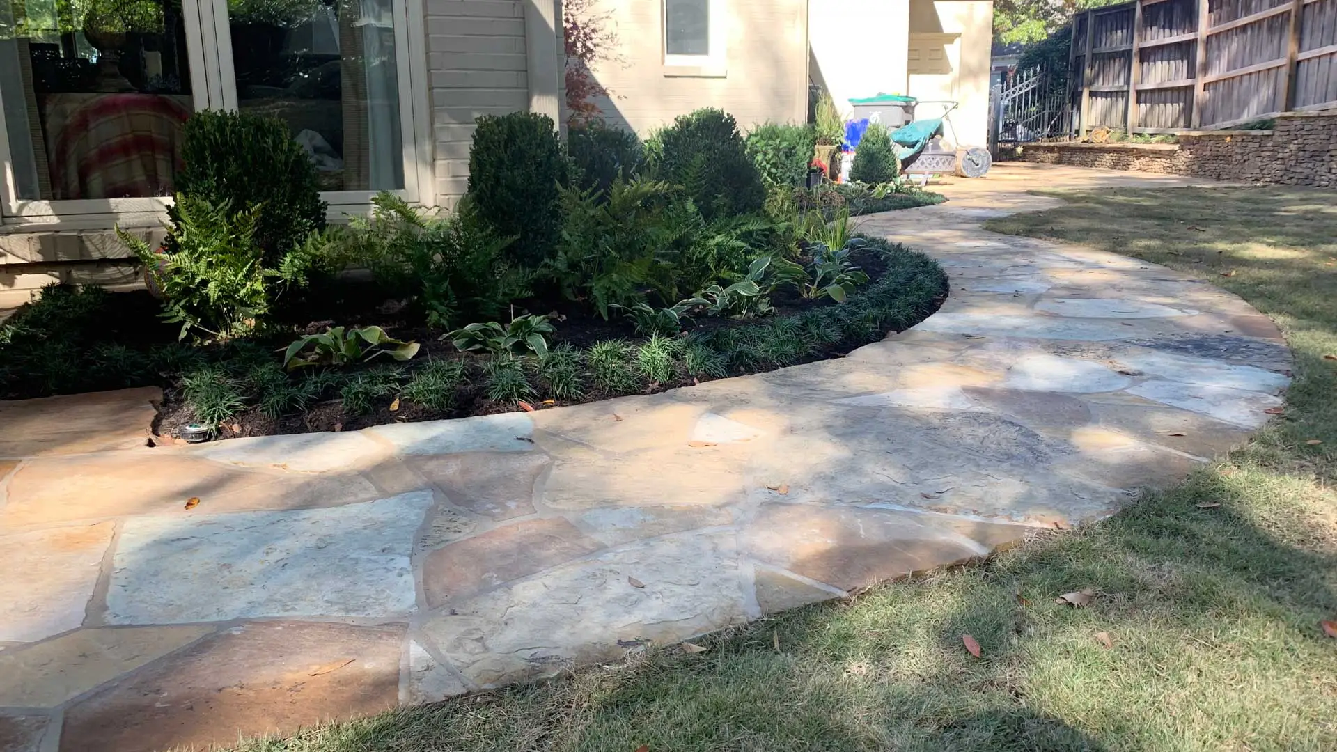 Paver walkway installed beside a landscape bed in Sea Isle Park, TN.