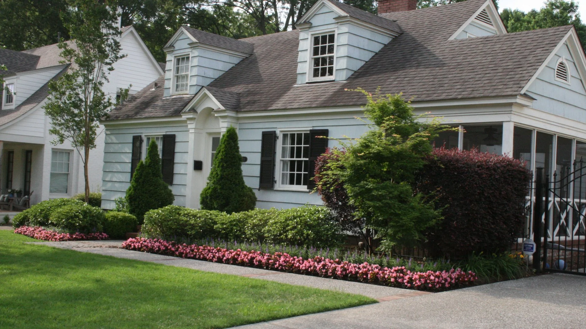 Flowers and shrubs in landscape beds.