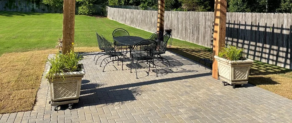 Concrete paver patio in Memphis, TN, with furniture and plants.