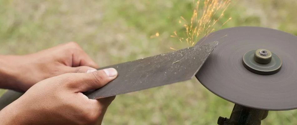 Mower blades being sharpened in Memphis, TN.