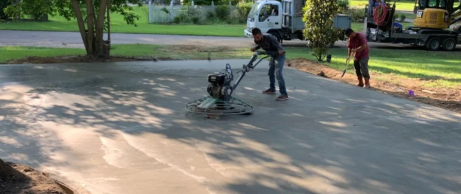 Professionals installing a poured concrete patio in Memphis, TN.