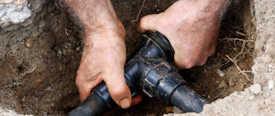 Broken pipe for irrigation system being repaired in Collierville, TN.