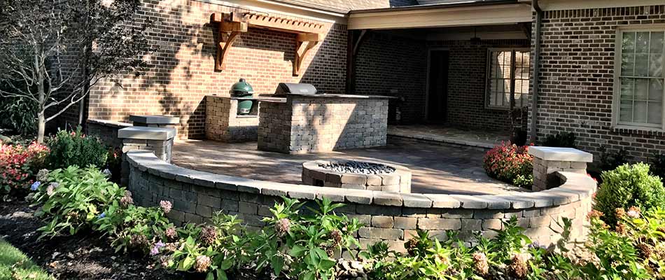 Custom fire pit and seating wall installed at a home in East Memphis, TN.