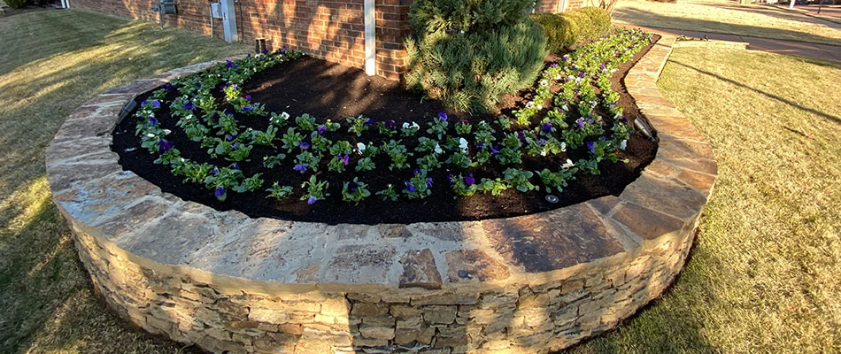 Dark mulch installation with flower plantings in Germantown, TN.