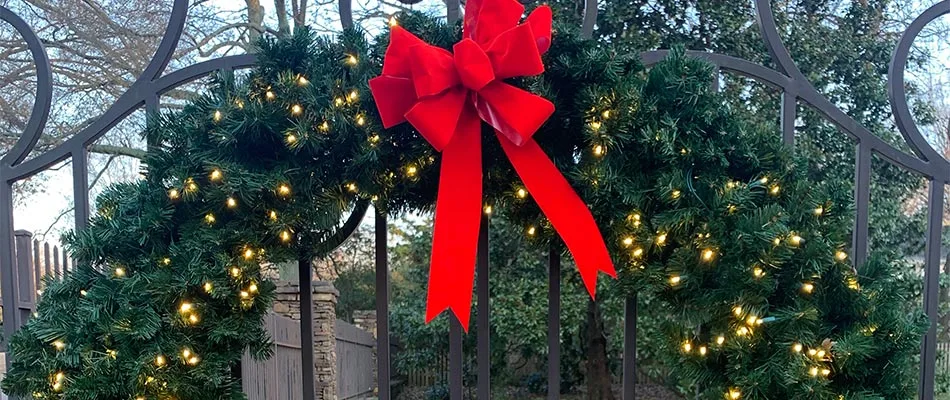 Holiday wreath with lights and red bow near Lakeland, TN.