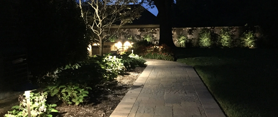 Landscape lights installed by pathway in Sea Isle Park, TN.