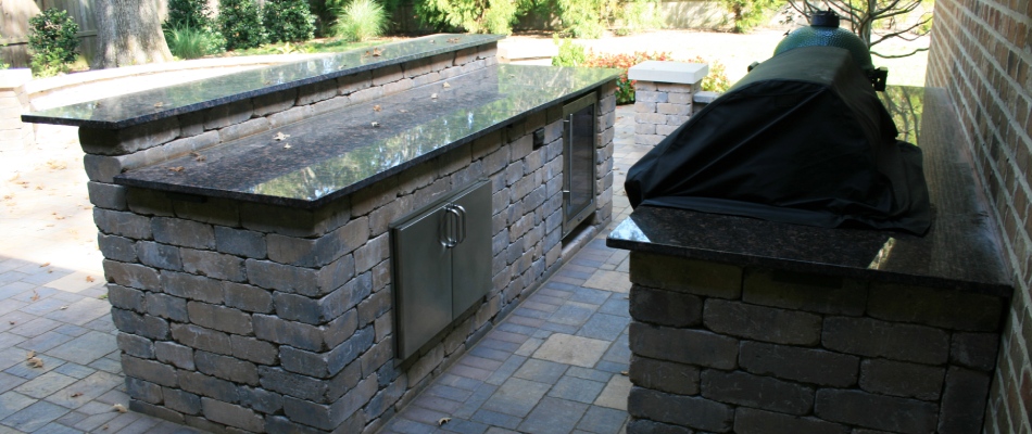 Outdoor kitchen with a cooler and fridge installed in Bartlett, TN.