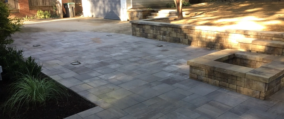 Patio installed with retaining wall and fire feature in Midtown Memphis, TN.