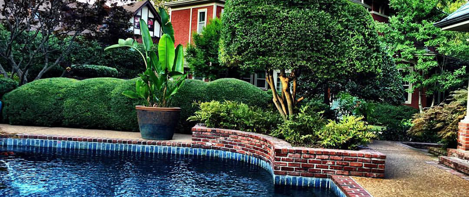 A retaining wall built next to a pool on a property in Piperton, TN.