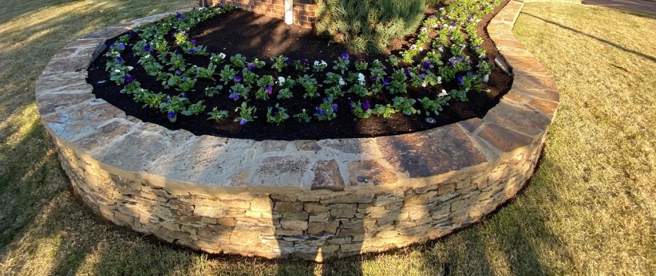 Flower bed retaining wall built in front yard in Arlington, TN.