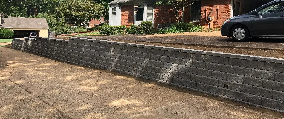 Retaining wall with driveway above it in Memphis, TN.