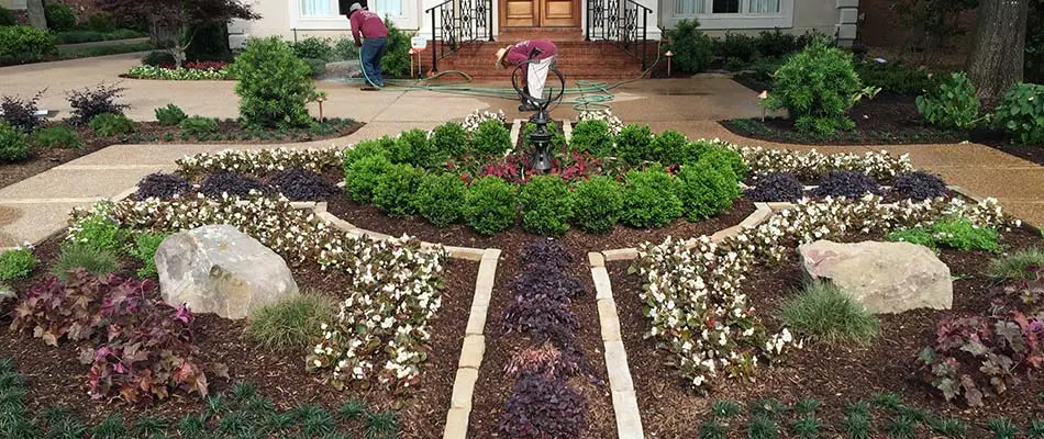 Symmetric landscape bed design at a home in Arlington, TN.