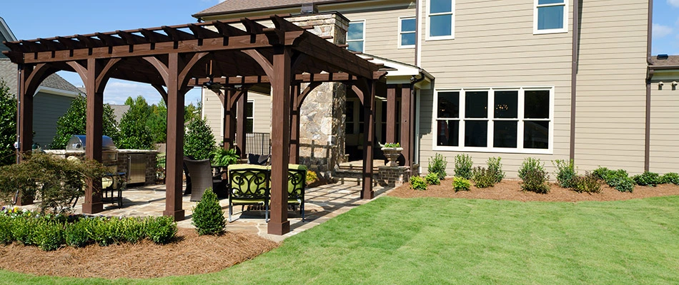 A wooden pergola built over a patio in our client's backyard in Bartlett, TN.