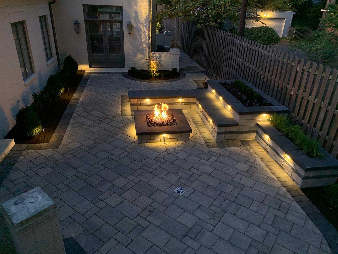 Outdoor living construction with a fire pit in East Memphis, TN.